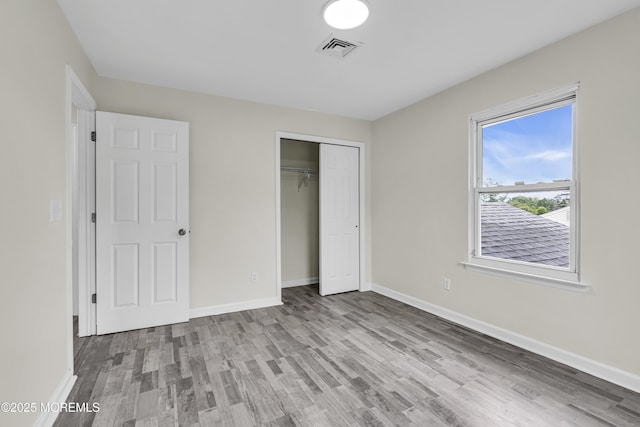 1217 Madison Ave, Toms River, NJ 08757 - unfurnished bedroom featuring wood finished floors and a closet