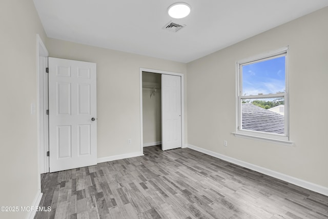1217 Madison Ave, Toms River, NJ 08757 - unfurnished bedroom with wood finished floors and a closet