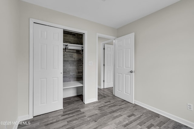 1217 Madison Ave, Toms River, NJ 08757 - unfurnished bedroom with wood finished floors and a closet