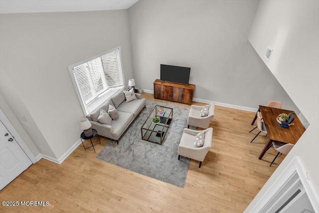 8 Eunice Ter, West Long Branch, NJ 07764 - living room featuring wood finished floors and a towering ceiling