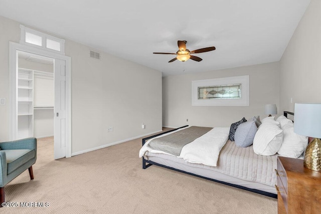 8 Eunice Ter, West Long Branch, NJ 07764 - bedroom with light colored carpet, a walk in closet, and ceiling fan