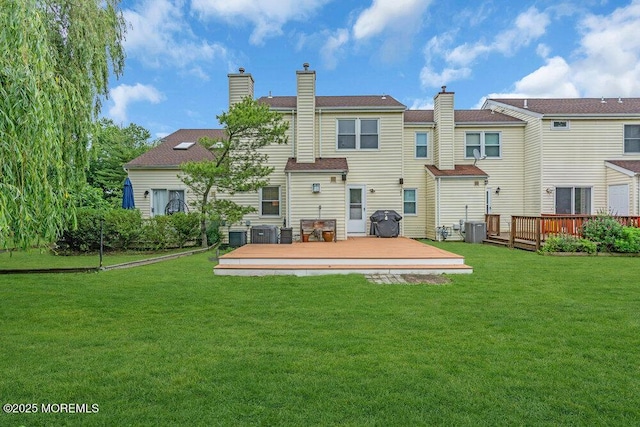 8 Eunice Ter, West Long Branch, NJ 07764 - back of property with a wooden deck, a yard, and a chimney