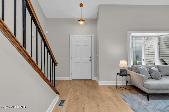 8 Eunice Ter, West Long Branch, NJ 07764 - foyer entrance with light wood-style flooring and stairs