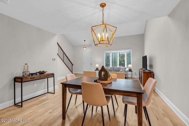 8 Eunice Ter, West Long Branch, NJ 07764 - dining area featuring light wood-style floors and a chandelier