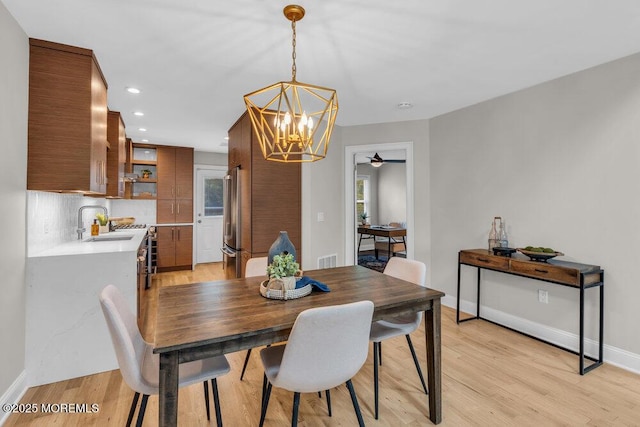 8 Eunice Ter, West Long Branch, NJ 07764 - dining area with a chandelier, light wood-type flooring, recessed lighting, a ceiling fan, and plenty of natural light