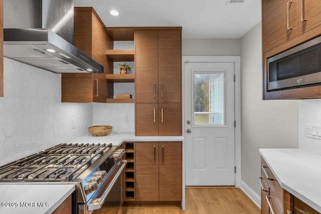 8 Eunice Ter, West Long Branch, NJ 07764 - kitchen featuring wall chimney range hood, stainless steel appliances, brown cabinets, open shelves, and decorative backsplash