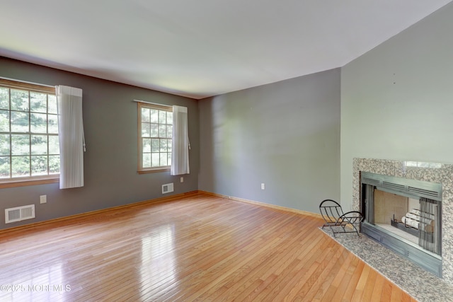 143 Siloam Rd, Freehold, NJ 07728 - unfurnished living room with hardwood / wood-style flooring and a fireplace with flush hearth