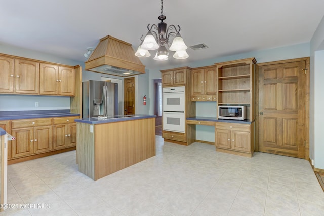 143 Siloam Rd, Freehold, NJ 07728 - kitchen with appliances with stainless steel finishes, dark countertops, a chandelier, a center island, and hanging light fixtures