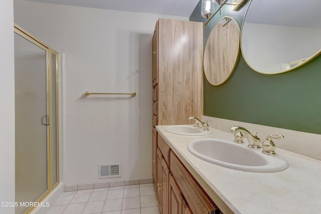 143 Siloam Rd, Freehold, NJ 07728 - bathroom featuring a stall shower, double vanity, and tile patterned flooring