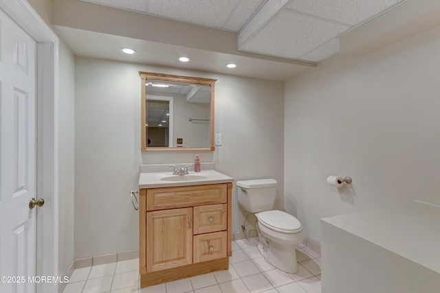 143 Siloam Rd, Freehold, NJ 07728 - half bathroom with vanity, tile patterned floors, recessed lighting, and a paneled ceiling
