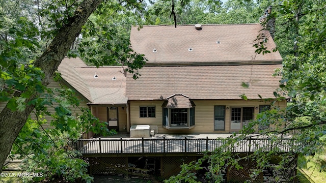 143 Siloam Rd, Freehold, NJ 07728 - back of house with a deck, a chimney, and a shingled roof
