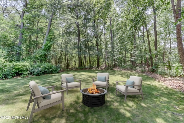 143 Siloam Rd, Freehold, NJ 07728 - view of grassy yard featuring an outdoor fire pit and a patio