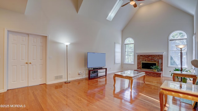 88 Vanderveer Dr, Basking Ridge, NJ 07920 - living area featuring high vaulted ceiling, ceiling fan, healthy amount of natural light, and wood finished floors