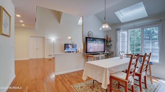 88 Vanderveer Dr, Basking Ridge, NJ 07920 - dining room featuring light wood-style floors, a skylight, vaulted ceiling, and recessed lighting