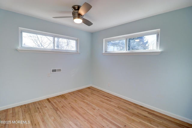 42 Cherry Tree Farm Rd, Middletown, NJ 07748 - empty room with plenty of natural light, wood finished floors, and ceiling fan
