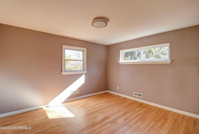 42 Cherry Tree Farm Rd, Middletown, NJ 07748 - spare room featuring plenty of natural light and wood-type flooring