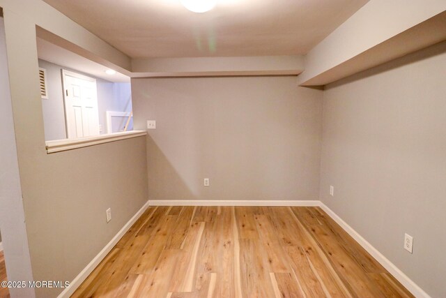 42 Cherry Tree Farm Rd, Middletown, NJ 07748 - spare room featuring light wood-style floors and baseboards