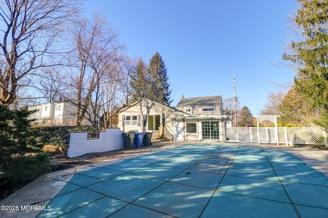 42 Cherry Tree Farm Rd, Middletown, NJ 07748 - back of house featuring a storage structure and a patio