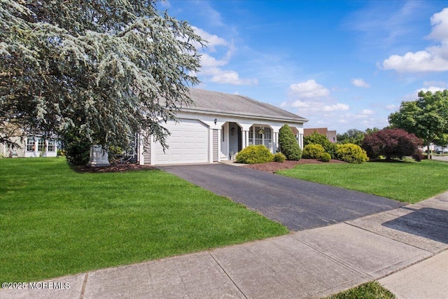 50 Normanton Ave, Manchester, NJ 08759 - view of front facade featuring an attached garage, asphalt driveway, and a front lawn