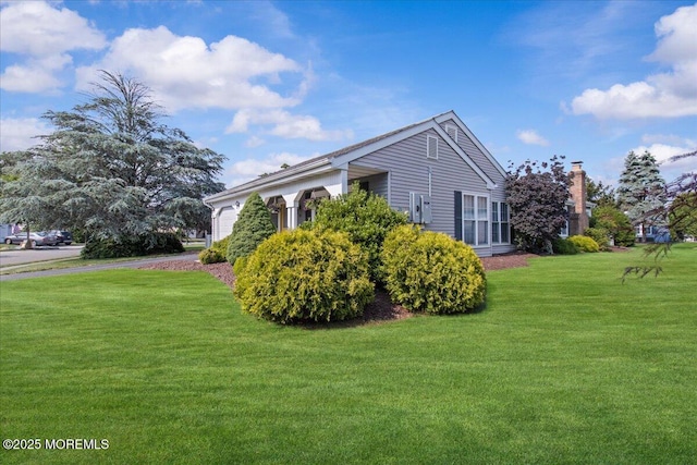 50 Normanton Ave, Manchester, NJ 08759 - view of side of home featuring a lawn and a garage