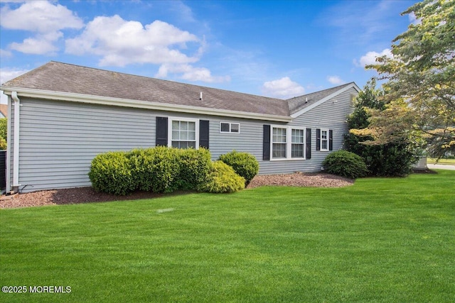 50 Normanton Ave, Manchester, NJ 08759 - rear view of property with a lawn and roof with shingles