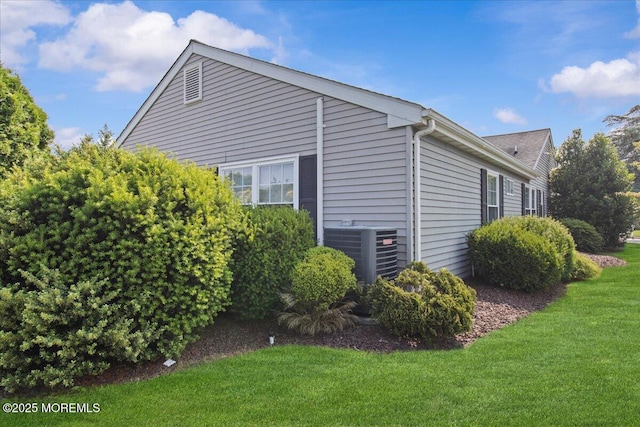 50 Normanton Ave, Manchester, NJ 08759 - view of side of home with a cooling unit and a yard