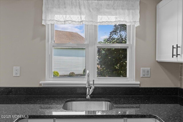 50 Normanton Ave, Manchester, NJ 08759 - kitchen view of white cabinets and dark stone counters