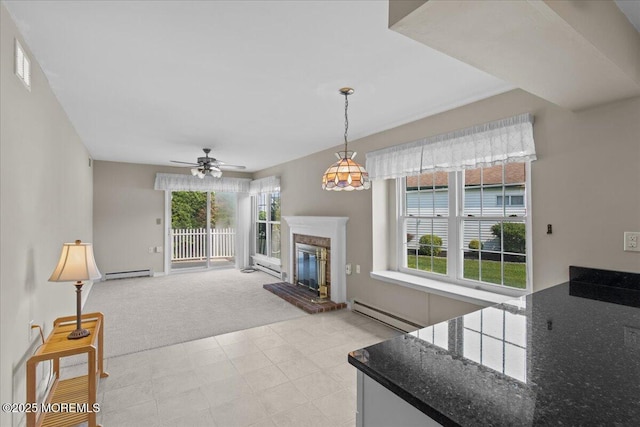 50 Normanton Ave, Manchester, NJ 08759 - living area with a baseboard heating unit, healthy amount of natural light, a ceiling fan, and light carpet