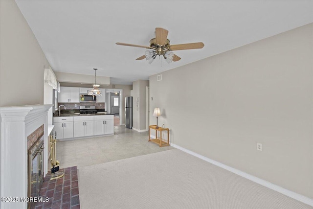 50 Normanton Ave, Manchester, NJ 08759 - unfurnished living room with a ceiling fan and a tiled fireplace