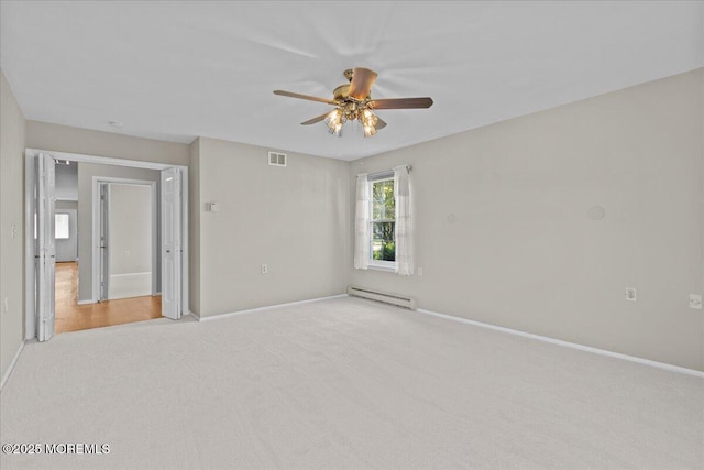 50 Normanton Ave, Manchester, NJ 08759 - spare room featuring baseboard heating, ceiling fan, and light carpet