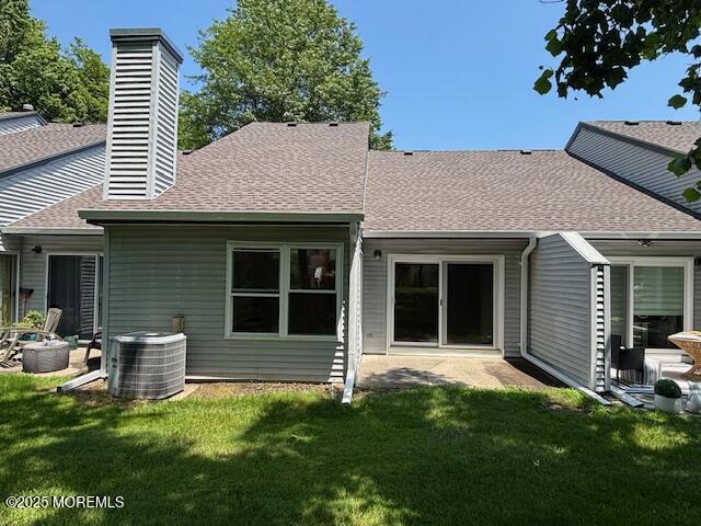 133 Sunnymede St, Englishtown, NJ 07726 - back of property featuring a shingled roof, a yard, a patio, and a chimney