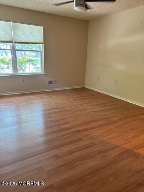 133 Sunnymede St, Englishtown, NJ 07726 - empty room with a ceiling fan, a textured ceiling, and wood finished floors