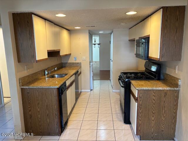 133 Sunnymede St, Englishtown, NJ 07726 - kitchen with black appliances, light tile patterned flooring, recessed lighting, light stone countertops, and white cabinetry