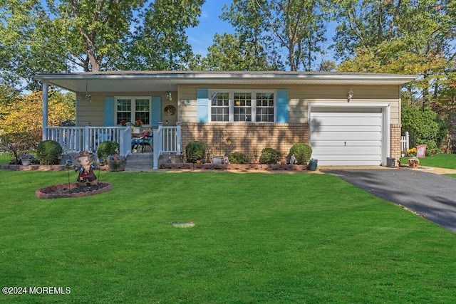 8 Wisconsin Ln, Whiting, NJ 08759 - view of front of house featuring covered porch, driveway, an attached garage, a front lawn, and brick siding