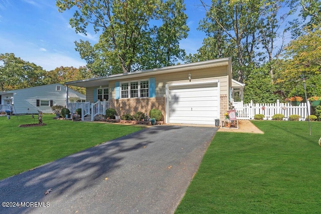 8 Wisconsin Ln, Whiting, NJ 08759 - view of front of house featuring an attached garage, driveway, and brick siding