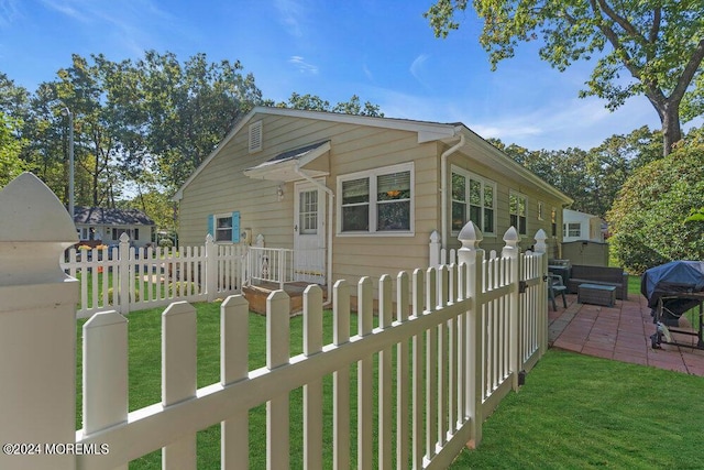 8 Wisconsin Ln, Whiting, NJ 08759 - view of side of home with a fenced front yard and a patio area