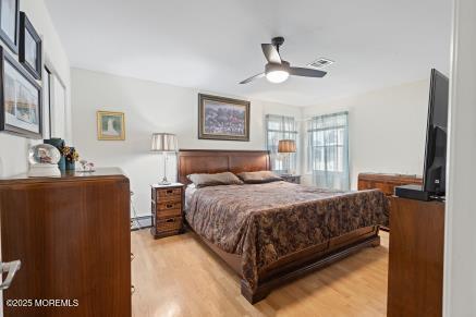 169 Pulaski Blvd, Toms River, NJ 08757 - bedroom with light wood-type flooring and a ceiling fan