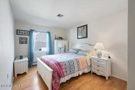 169 Pulaski Blvd, Toms River, NJ 08757 - bedroom with light wood-type flooring and baseboards