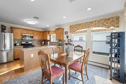 169 Pulaski Blvd, Toms River, NJ 08757 - dining room featuring a baseboard heating unit, recessed lighting, and light wood-style floors