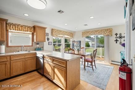 169 Pulaski Blvd, Toms River, NJ 08757 - kitchen with a peninsula, light countertops, light wood-style floors, healthy amount of natural light, and recessed lighting