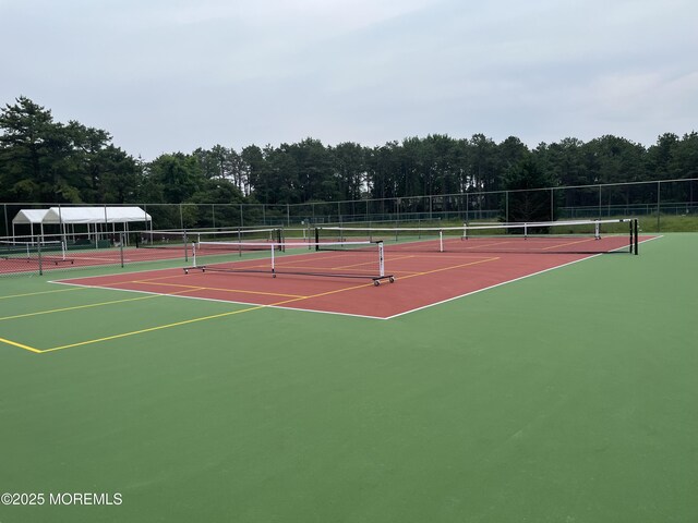169 Pulaski Blvd, Toms River, NJ 08757 - view of tennis court featuring community basketball court and a wooded view