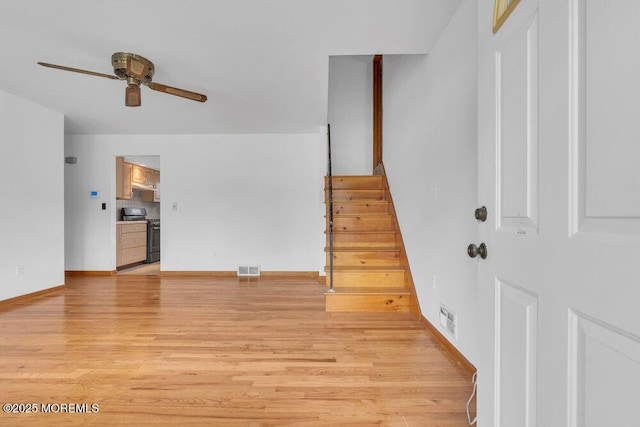 1316 Sunset Ave, Point Pleasant, NJ 08742 - unfurnished living room with a ceiling fan, light wood-style flooring, and stairs