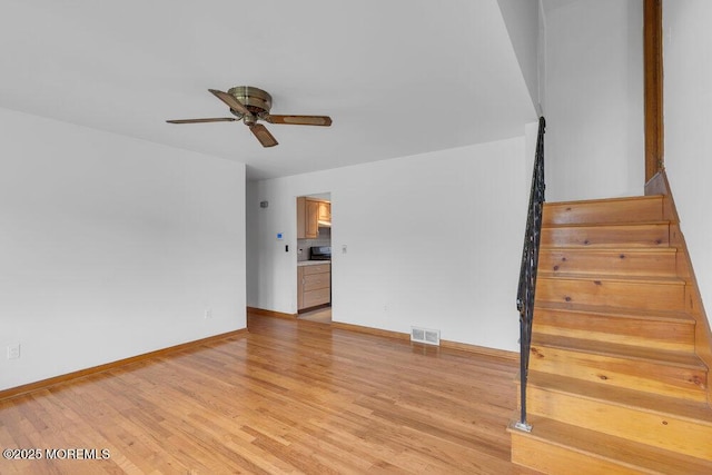 1316 Sunset Ave, Point Pleasant, NJ 08742 - unfurnished living room with ceiling fan, stairway, and light wood-style floors