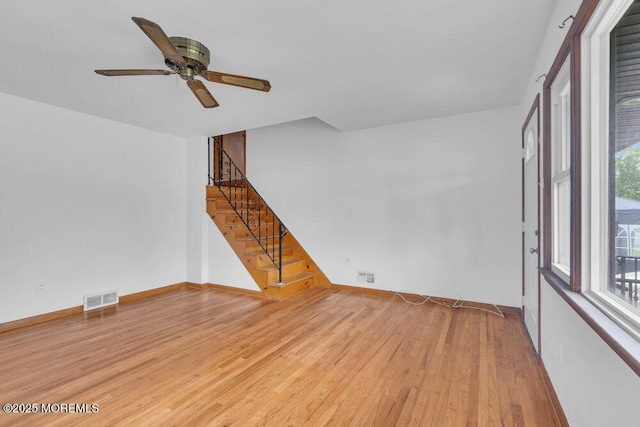 1316 Sunset Ave, Point Pleasant, NJ 08742 - unfurnished room featuring wood finished floors, stairway, plenty of natural light, and a ceiling fan