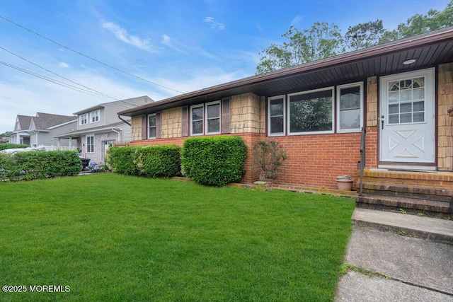 1316 Sunset Ave, Point Pleasant, NJ 08742 - view of front of home with brick siding, a front lawn, and entry steps