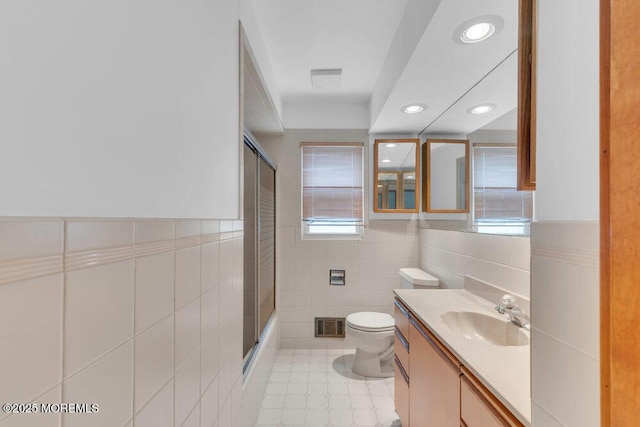 1316 Sunset Ave, Point Pleasant, NJ 08742 - full bath with tile walls, vanity, recessed lighting, enclosed tub / shower combo, and a wainscoted wall