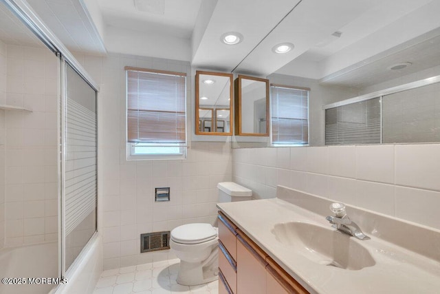 1316 Sunset Ave, Point Pleasant, NJ 08742 - full bathroom featuring tile walls, recessed lighting, vanity, shower / bath combination with glass door, and tile patterned floors