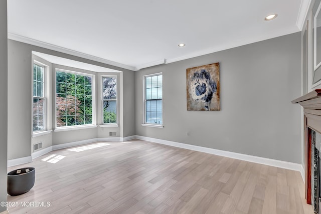 8 Armistead Ky, Colts Neck, NJ 07722 - unfurnished living room with ornamental molding, light wood-style flooring, recessed lighting, and a fireplace