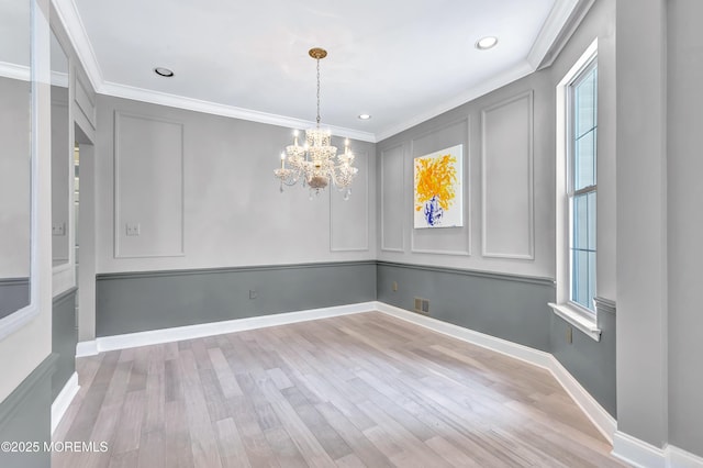 8 Armistead Ky, Colts Neck, NJ 07722 - unfurnished dining area featuring ornamental molding, a chandelier, wood finished floors, recessed lighting, and a decorative wall