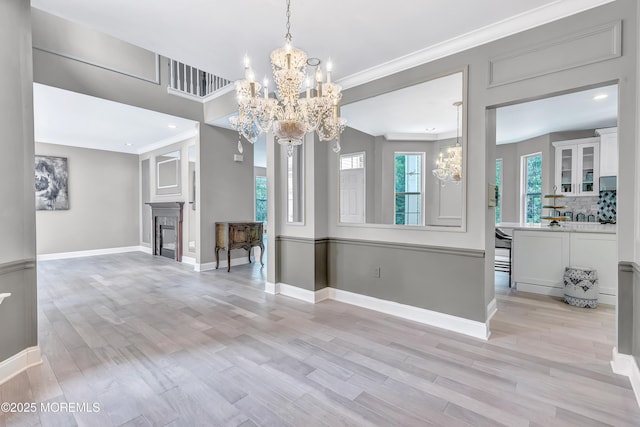 8 Armistead Ky, Colts Neck, NJ 07722 - unfurnished living room with a chandelier, light wood finished floors, ornamental molding, a fireplace, and recessed lighting